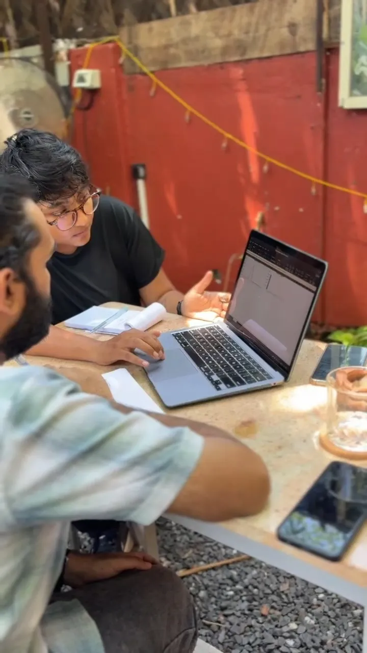 Sayantika showing a receipt-to-ledger workflow on a laptop during a workshop at Ruby's